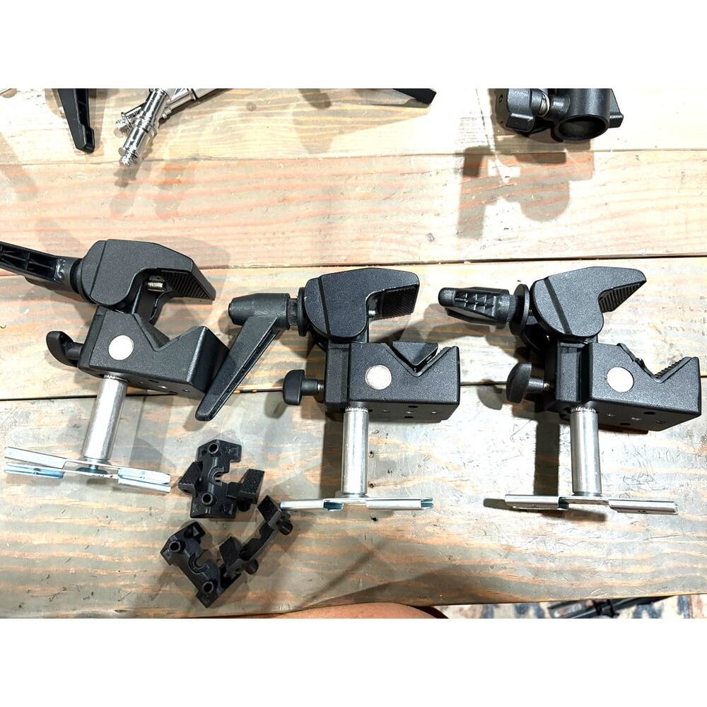 3 Manfrotto super clamps with post and scissor clips